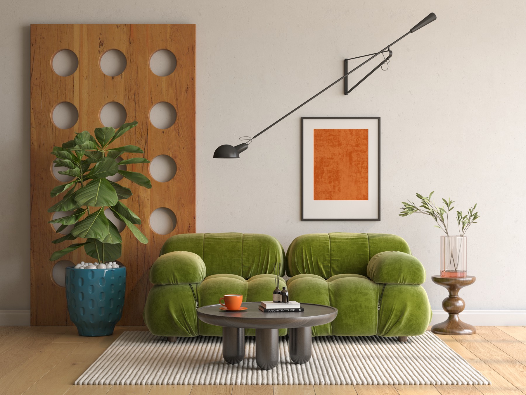An avocado-green velvet sofa under a slim black wall lamp, with a low round table and a burnt-orange print — the kind of room the Mushroom is made for.