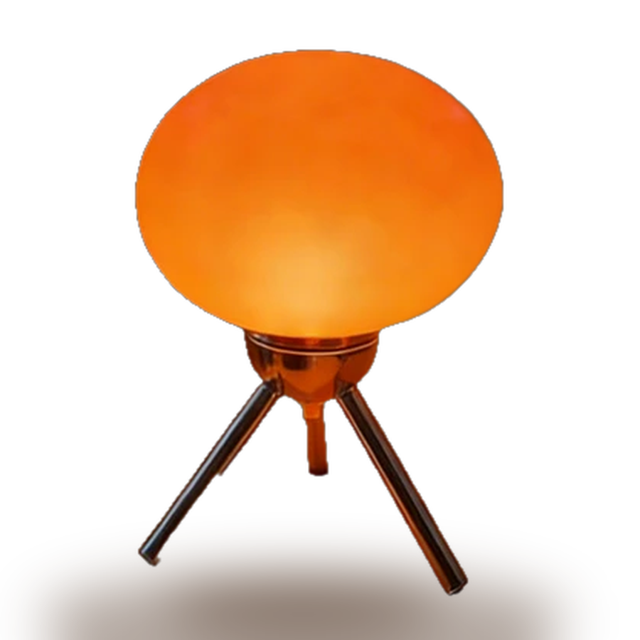 Bauhaus — a rounded amber glass shade balanced on three slim chrome legs.